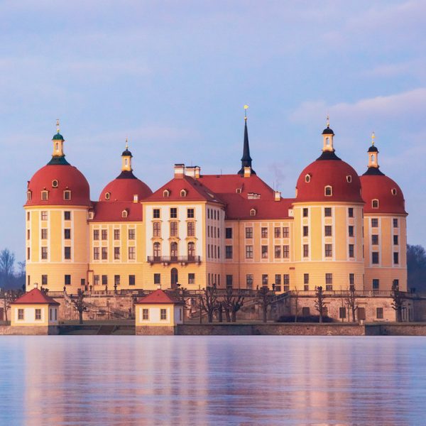 Moritzburg castle after sunrise at winter time, Germany Moritzburg castle after sunrise at winter time, Germany
