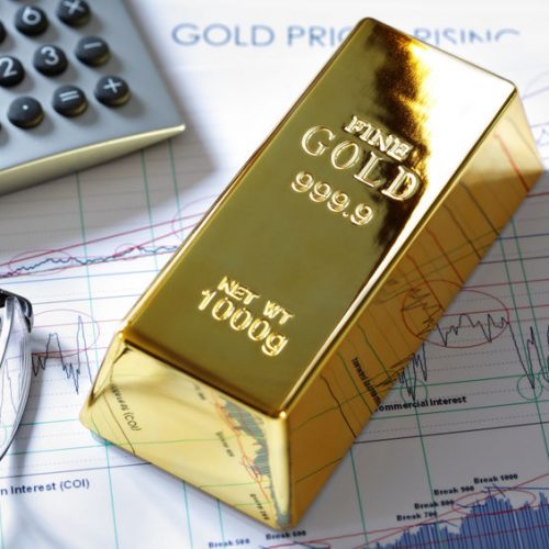 Gold bullion barr on a stocks and shares chart Gold bullion barr on a stocks and shares chart
